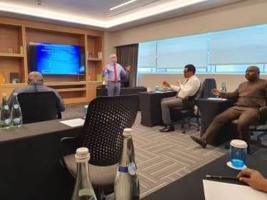 Presenter addressing a classroom of delegates