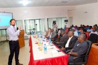 Presenter speaking to a full room of delegates