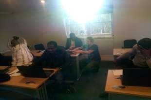Delegates at laptops during the session