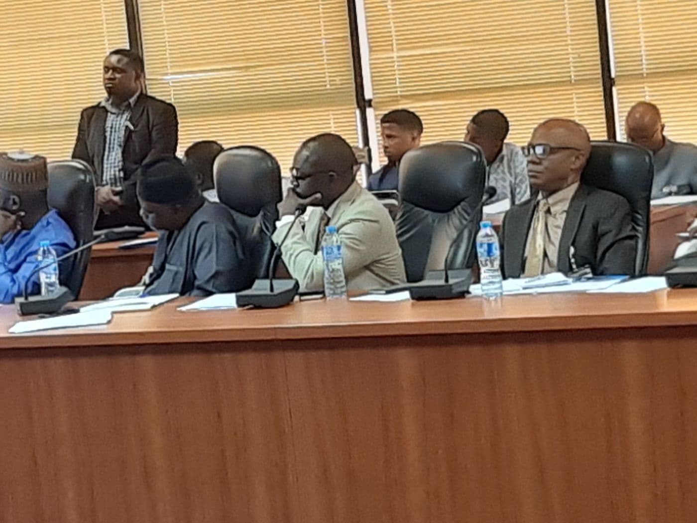 Delegates listening at the conference table