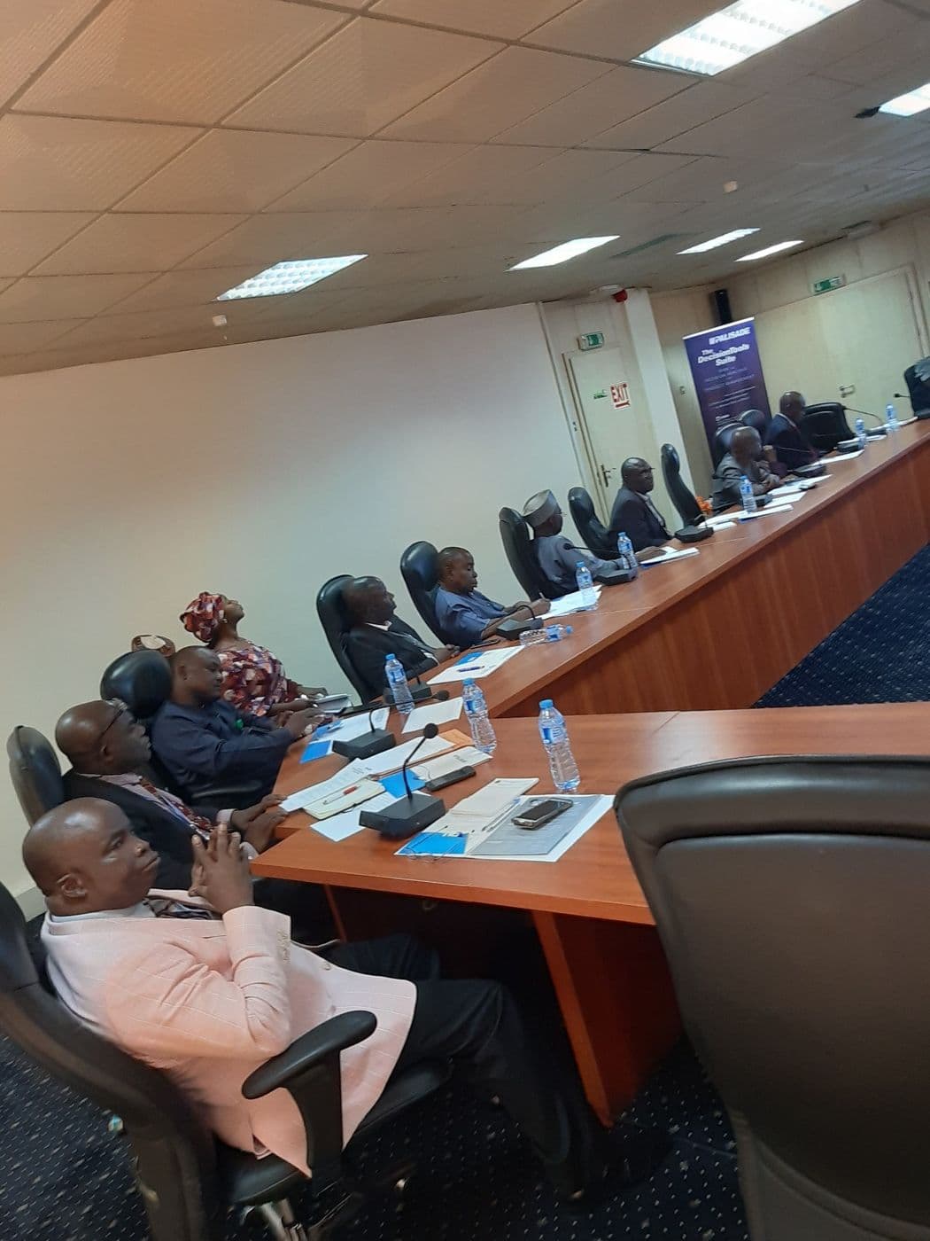 Delegates seated along the conference table