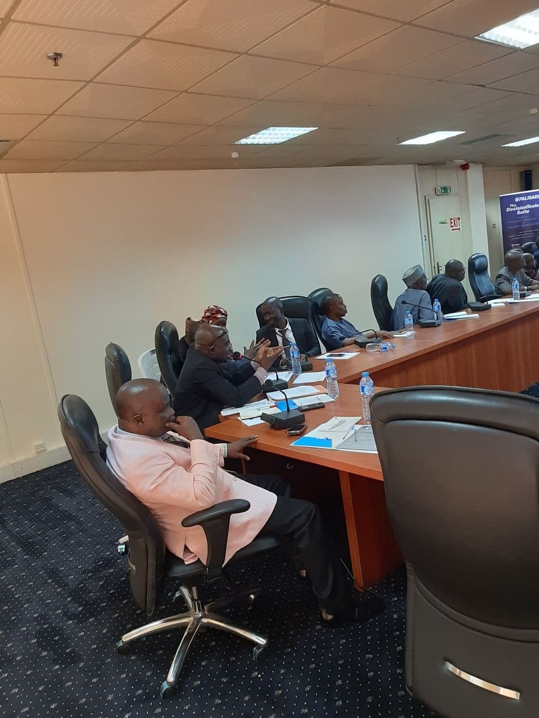Delegates seated around the conference room